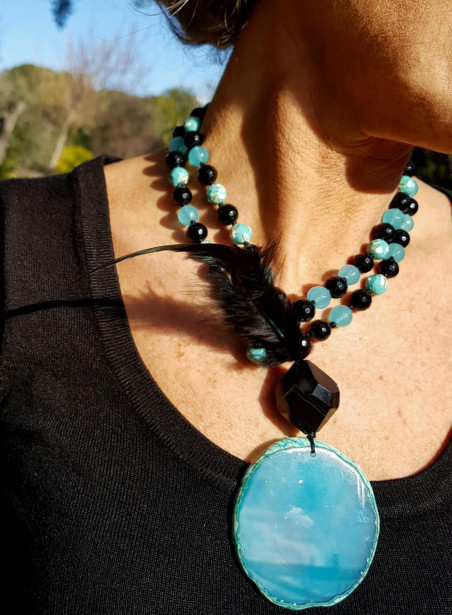 Long necklace of black agates and turquoise with feather pendant