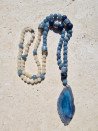 Long necklace of blue and ochre agates with a blue agate pendant