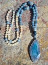 Long necklace of blue and ochre agates with a blue agate pendant