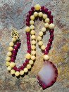 Long necklace of pink agates and garnets with an agate pendant