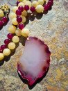 Long necklace of pink agates and garnets with an agate pendant